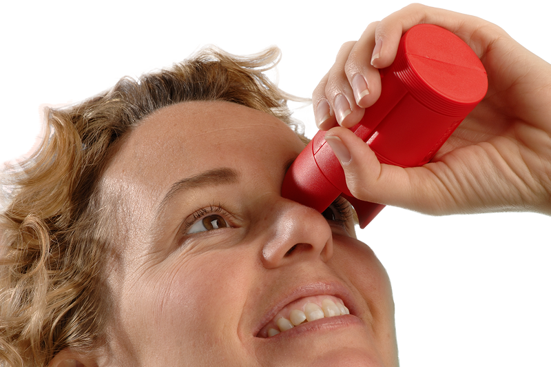 opticare eye drop aid being used to target the eye and squeeze the bottle